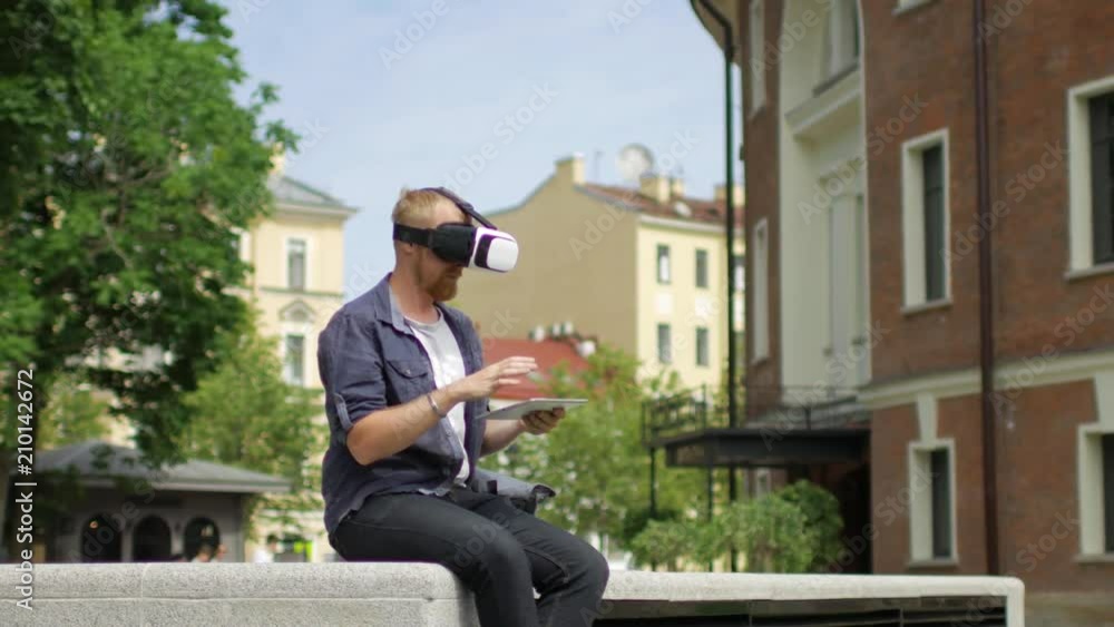 a man with virtual reality glasses on the street a man with virtual reality glasses on the street