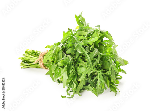 Bunch of fresh arugula on white background