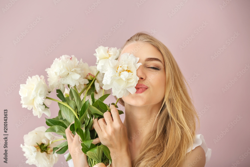 Attractive young woman with beautiful flowers on color background Attractive young woman with beautiful flowers on color background