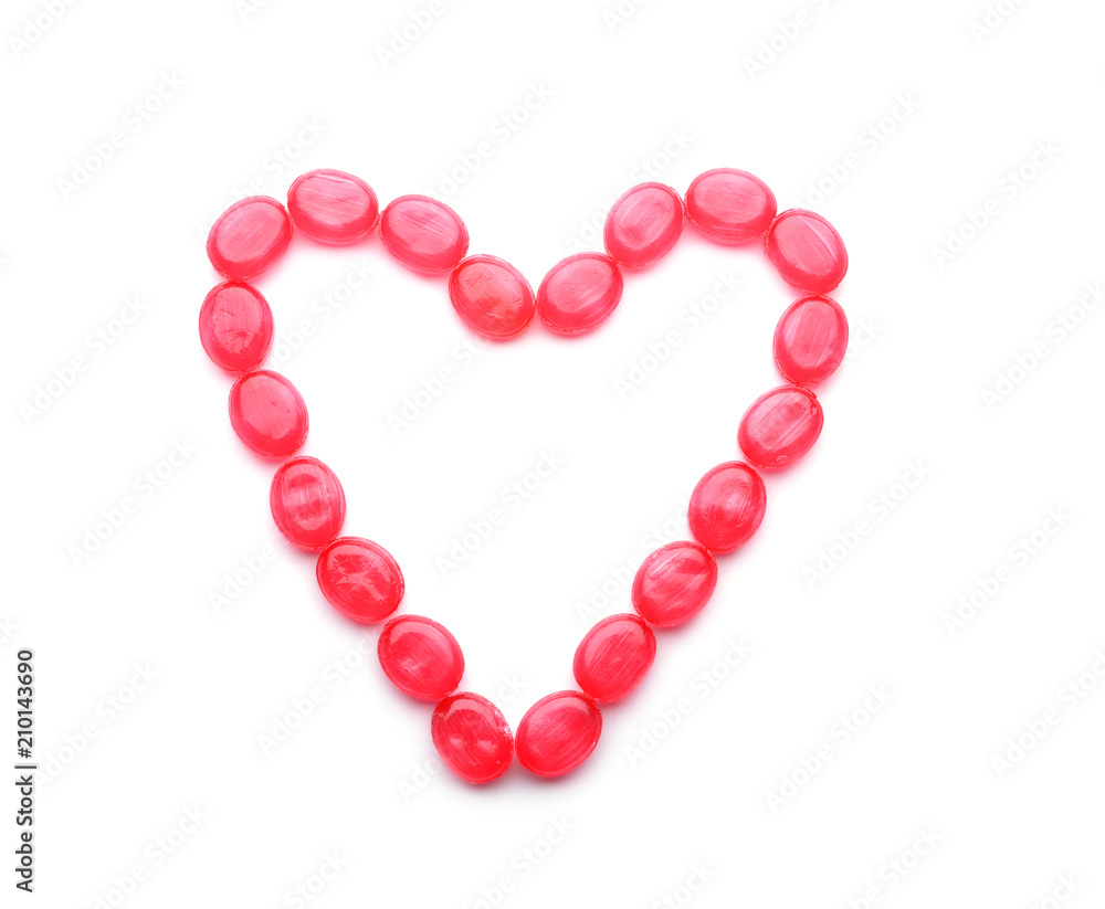 Heart made of sweet candies on white background Heart made of sweet candies on white background