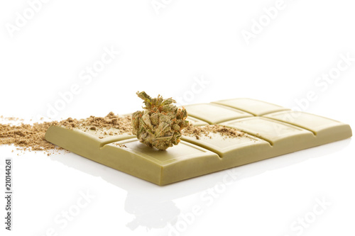 Green cannabis chocolate block with marijuana bud