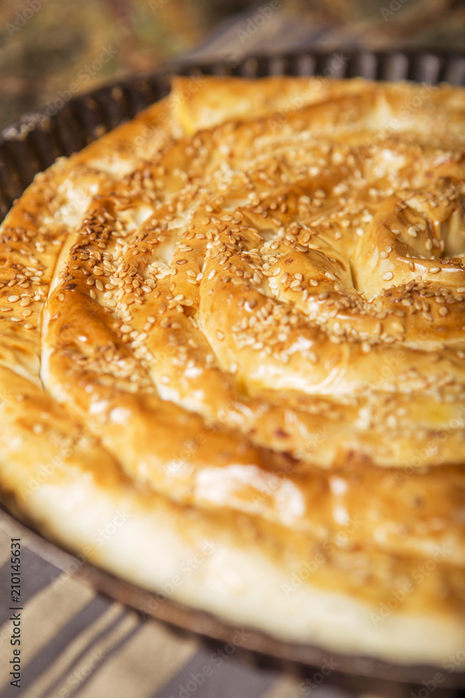 Cheese baked salt pie lay on table Cheese baked salt pie lay on table