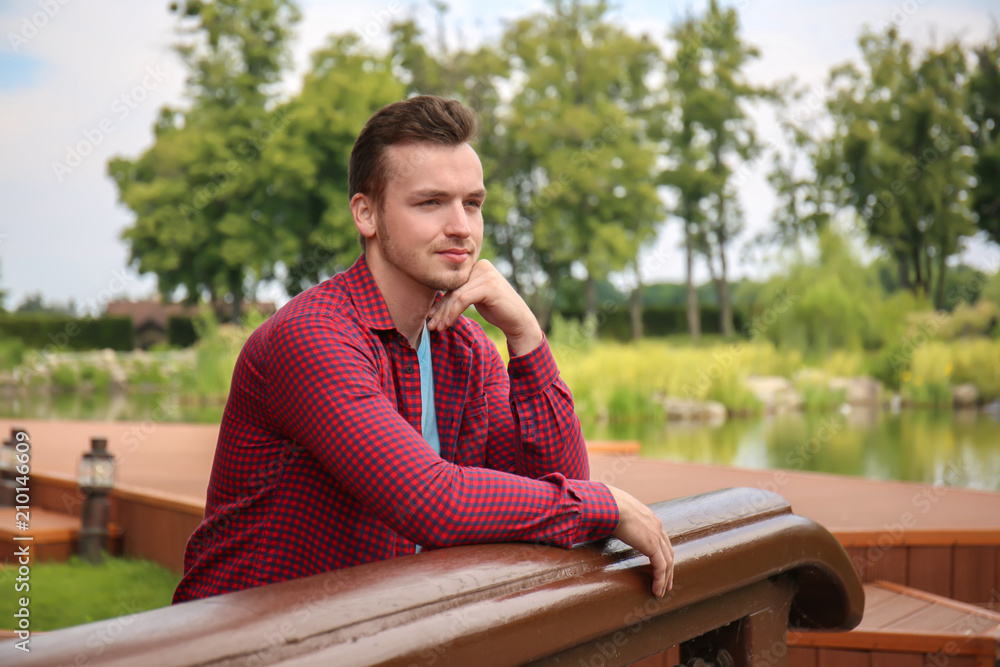 Young man relaxing outdoors Young man relaxing outdoors