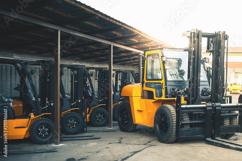 Background of a lot of forklifts, reliable heavy loader, truck