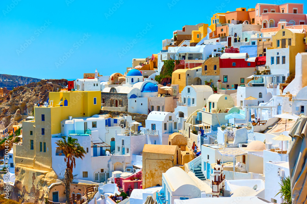Houses of different colours in Santorini