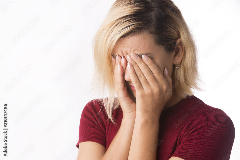 Depressed stressed woman crying and covering her face isolated on white Depressed stressed woman crying and covering her face isolated on white