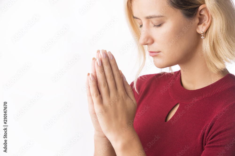 Woman praying with hands together on white Woman praying with hands together on white