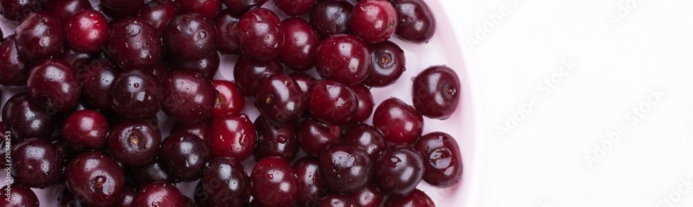 Banner Concept summer. Scattered fresh red ripe cherry on a white concrete background. Design Copy Space Top View Flat Lay Close-up. Banner Concept summer. Scattered fresh red ripe cherry on a white concrete background. Design Copy Space Top View Flat Lay Close-up.