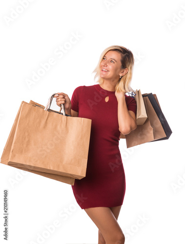 Smiling young happy woman with shopping bags over white background-Happiness, consumerism, sale and people concept. Isolated on white