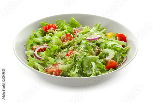 Plate with quinoa salad on white background