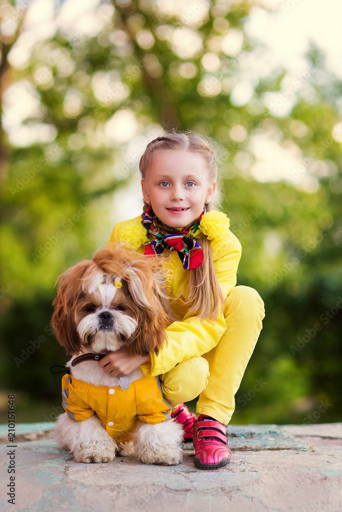 Girl and dog as friends happy together in summer in the nature Girl and dog as friends happy together in summer in the nature