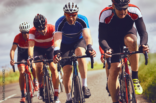 Obraz na płótnie Cyclists racing on country roads on a sunny day in the UK. w salonie