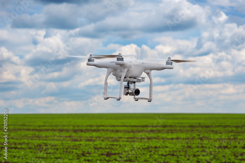 flight of quadrocopter over bean field