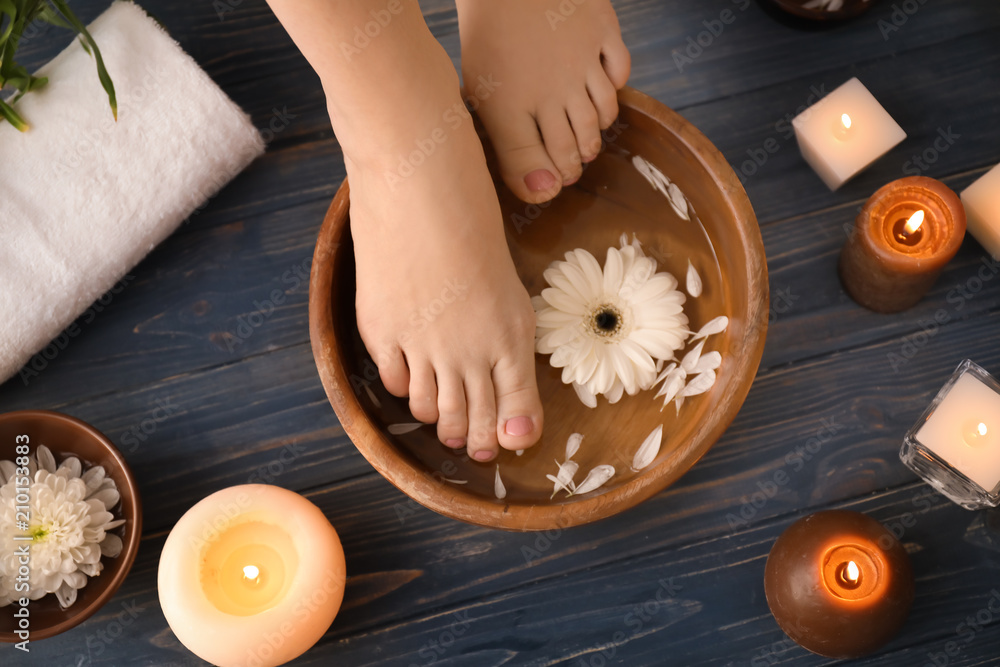 Young woman undergoing spa pedicure treatment in beauty salon Young woman undergoing spa pedicure treatment in beauty salon