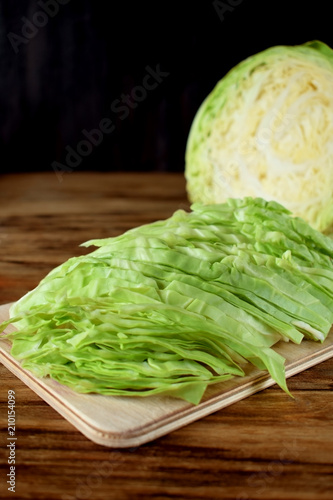 Chopped white cabbage on a wooden board