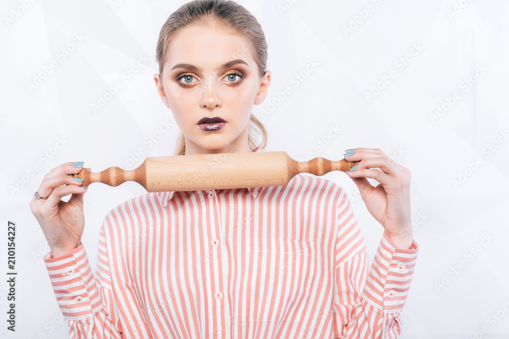 Woman chef holding rolling pin.Sexy baker chef holding a rolling pin Woman chef holding rolling pin.Sexy baker chef holding a rolling pin