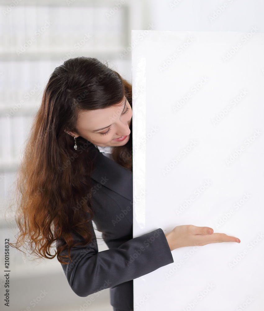 smiling business woman showing at blank poster smiling business woman showing at blank poster