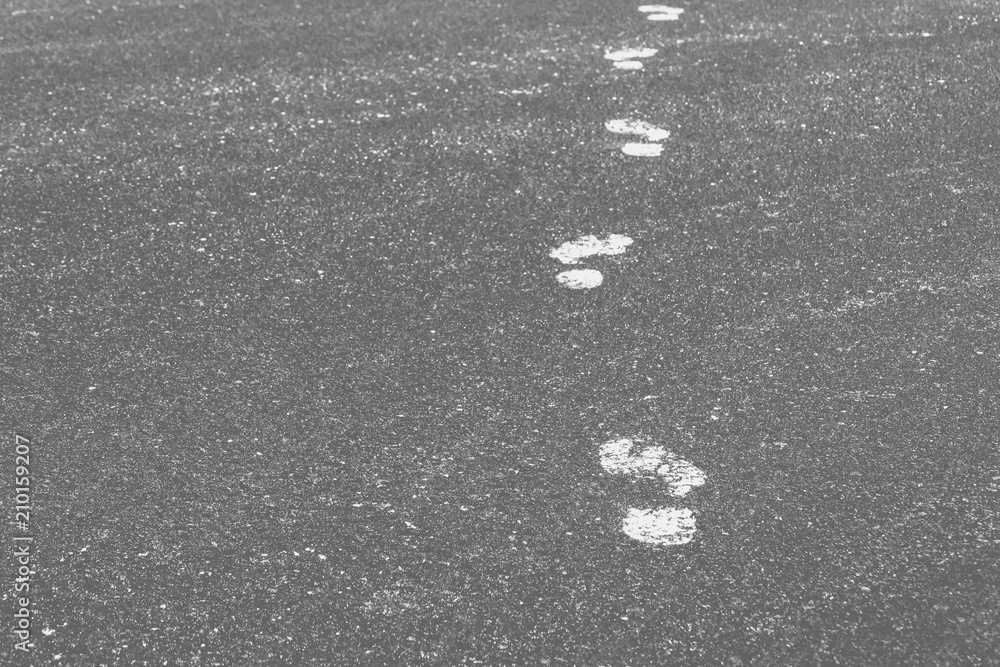 abstract background of the foot prints on the paved road abstract background of the foot prints on the paved road