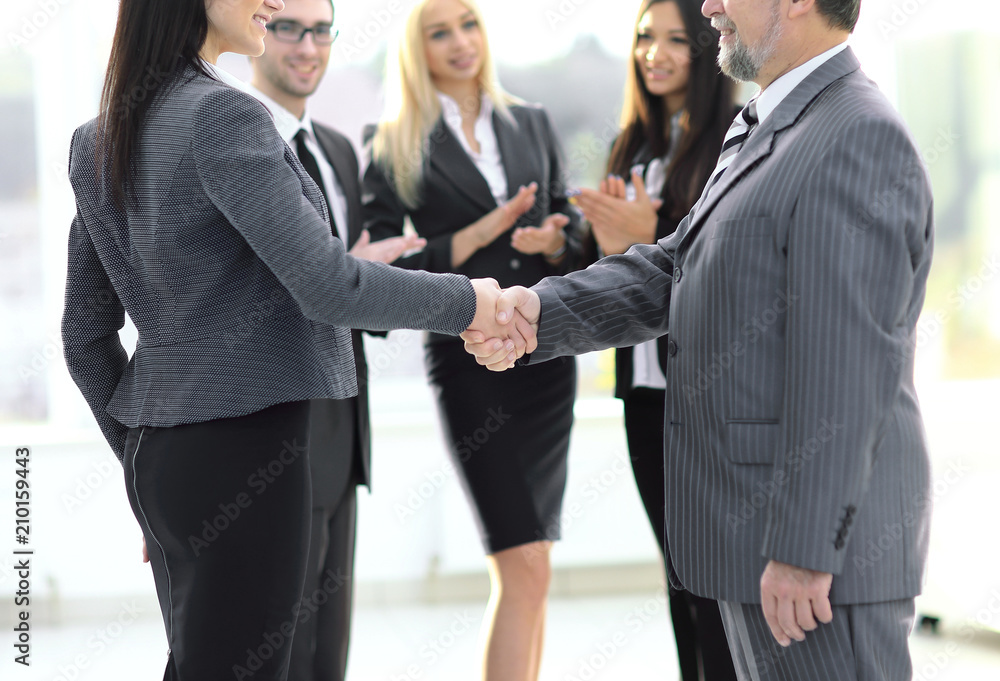 handshake of a businessman and business woman handshake of a businessman and business woman