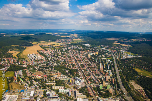 Landscape with big city in Czech republic - Brno from above surrounded by forests and hills