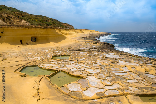 Salt evaporation ponds, also called salterns or salt pans located near Qbajjar on the maltese Island of Gozo. photo