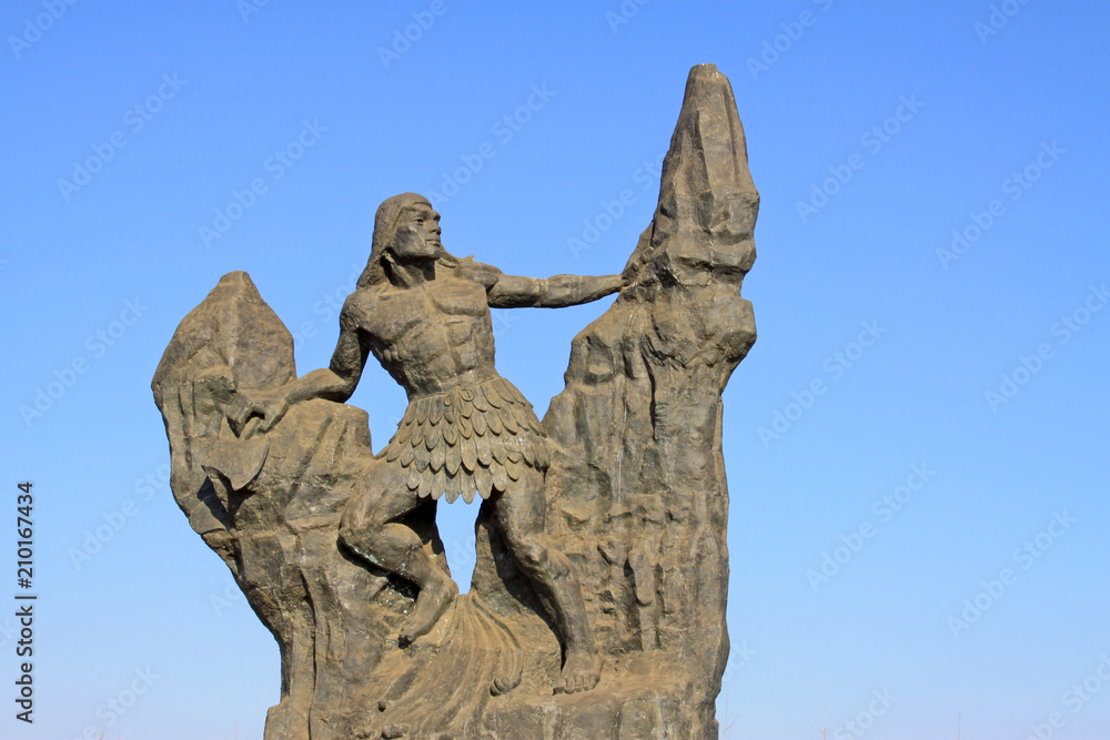 figure sculpture in the blue sky background