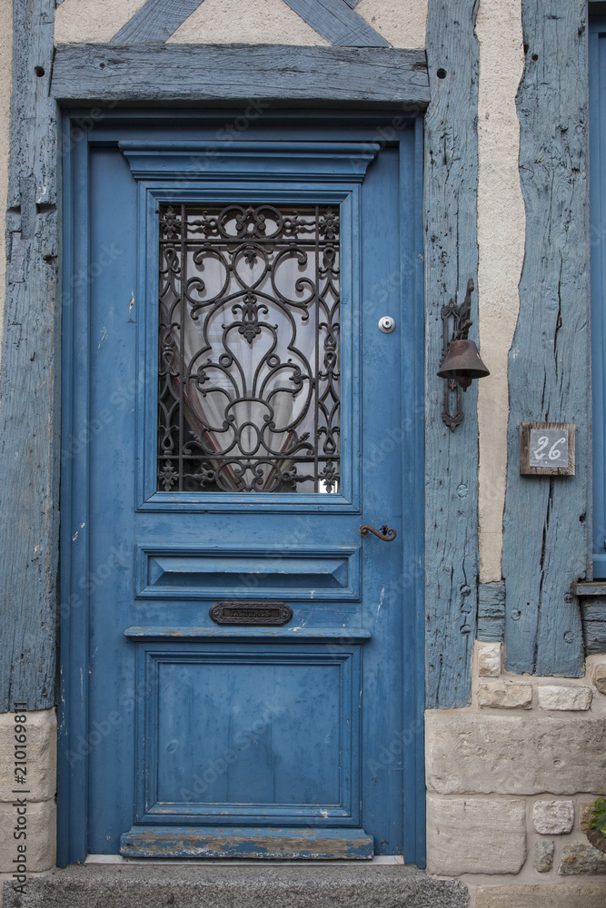 2018-06-12 Normandy France.  Old door of a traditional house  in medieval village of Beaumont en Auge in Normandy France