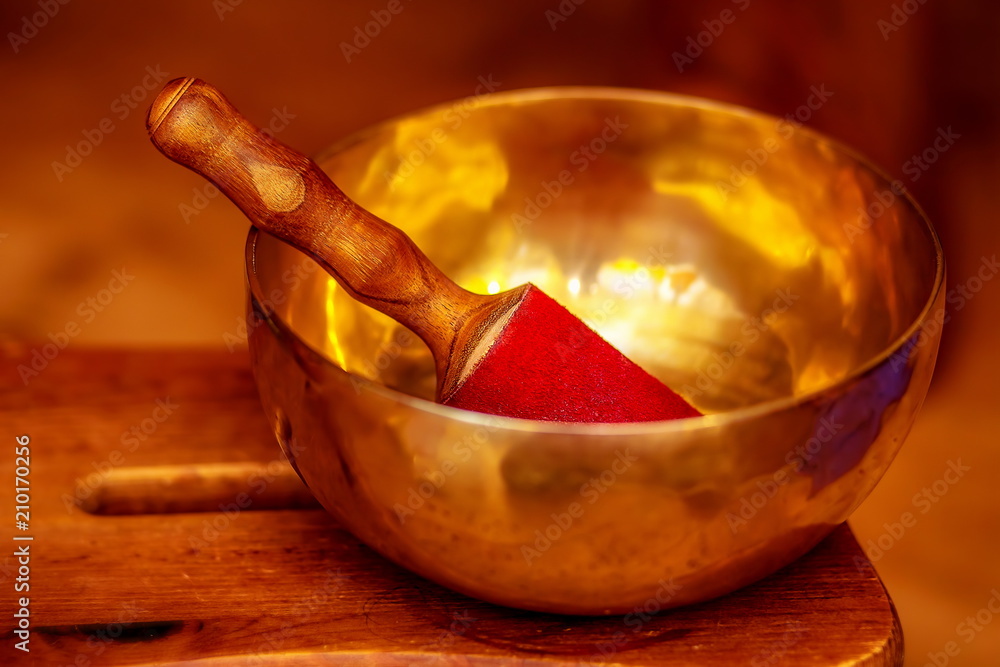 beautiful tibetian bowl with golden light reflections. beautiful tibetian bowl with golden light reflections.
