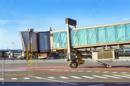 Stationary terminal gates on airport runway, Marupe, Riga, Latvia. Road transport infrastructure of the international airport. Glass landing sleeve waiting for the arrival of the aircraft