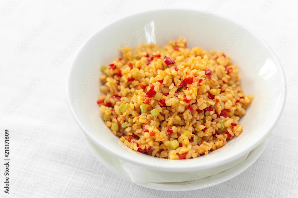 Arabic traditional cuisine - Couscous with tomato and green onion Arabic traditional cuisine - Couscous with tomato and green onion