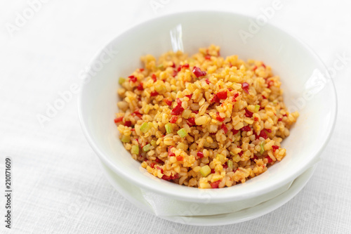 Arabic traditional cuisine - Couscous with tomato and green onion