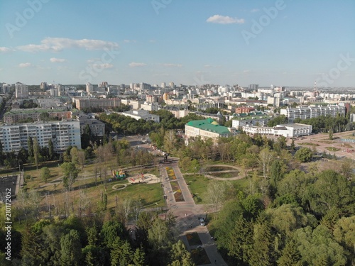 flight over the river in a city park among trees