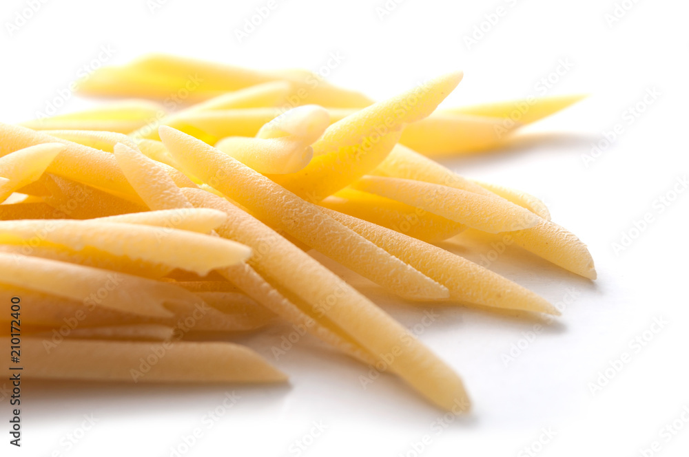 closeup of penne pasta on white background closeup of penne pasta on white background