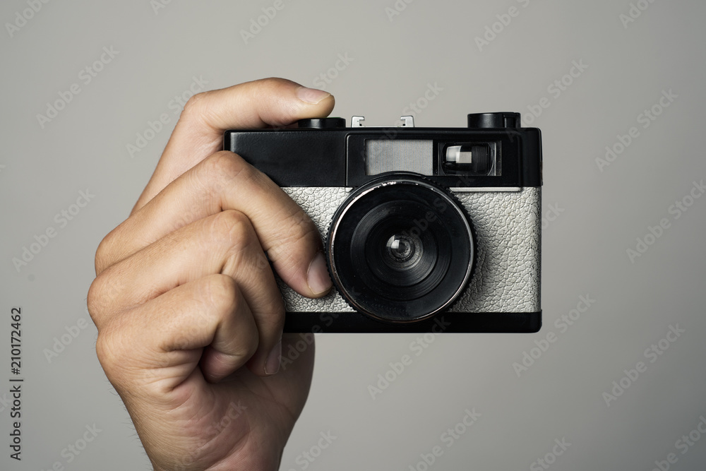 man with a film camera in his hand man with a film camera in his hand