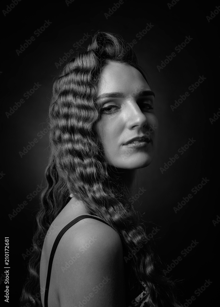 Portrait of a beautiful woman with perfect long hair .