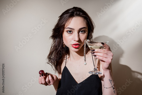 Glamorous woman with champagne. Romantic dinner photo