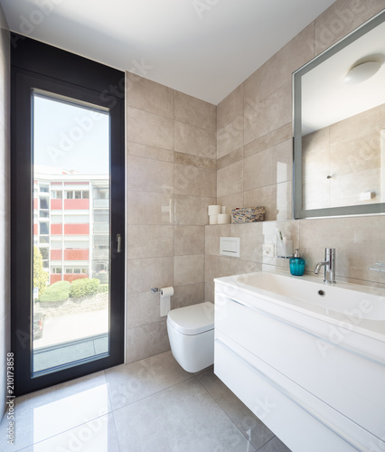 Modern bathroom in a marble designer apartment