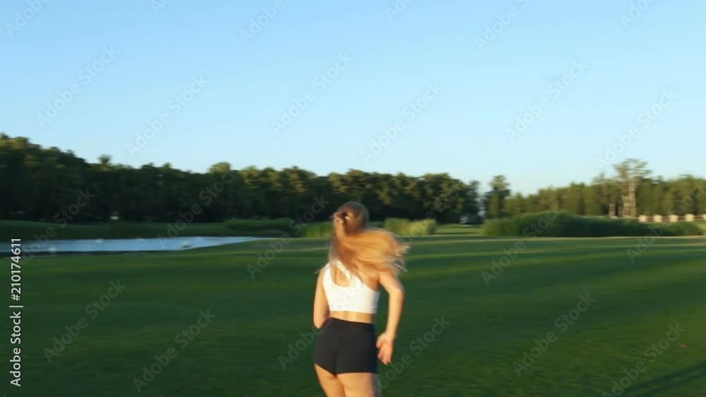 Woman jogging in the park, outdoors. Woman jogging in the park, outdoors.