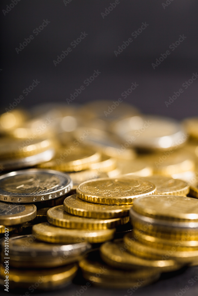 Close-up to stacks and heaps of Euro money coins