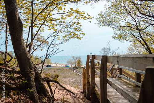 Fototapeta Naklejka Na Ścianę i Meble -  Looking out from the wooded part of the boardwalk at Lake Michigan