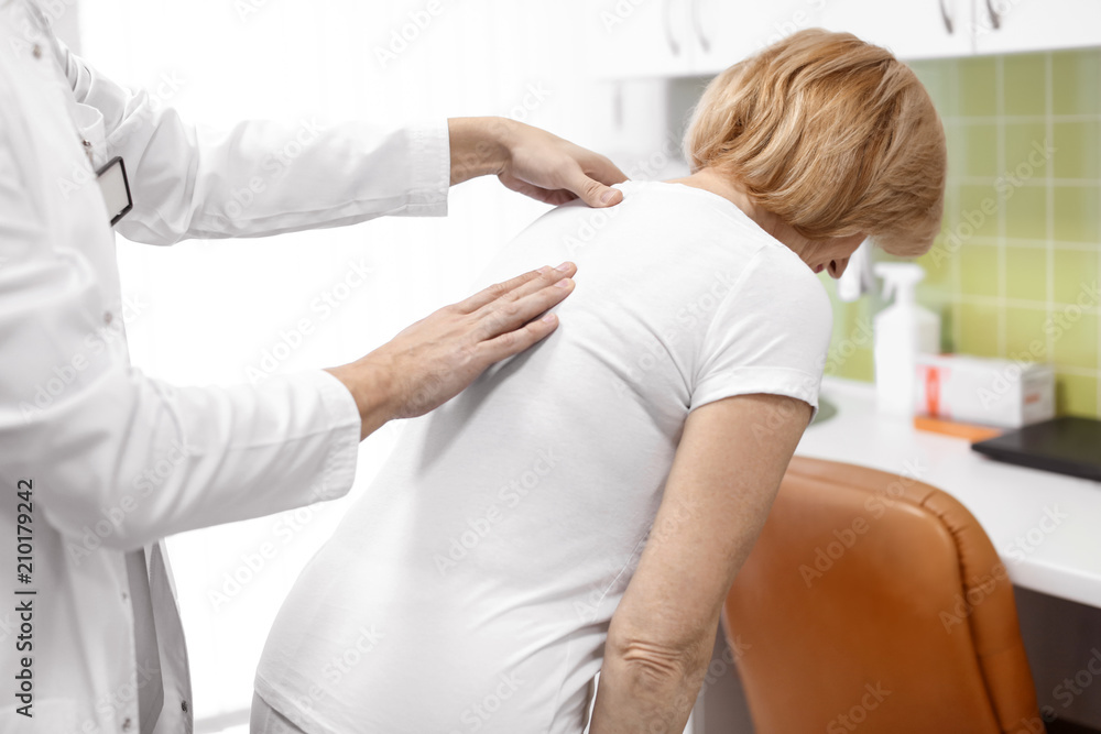 Orthopedist examining patient in hospital Orthopedist examining patient in hospital