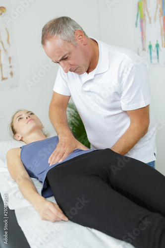 physical therapist treating patient