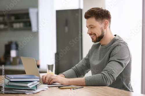 Freelancer working with laptop at home