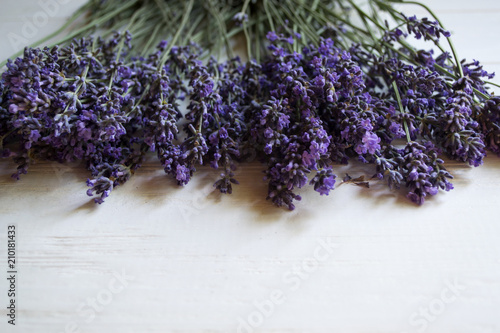 Fototapeta Naklejka Na Ścianę i Meble -  Fresh lavender flowers on a white wooden background.