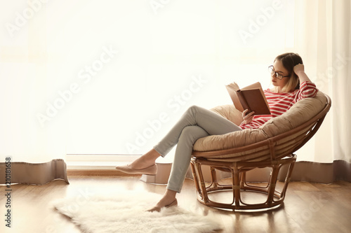 Young woman reading interes...