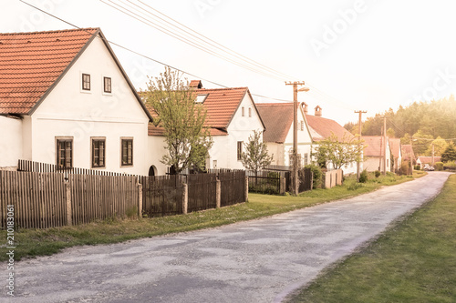 Fototapeta Naklejka Na Ścianę i Meble -  Traditional European historic family houses in street, Repaired historic building with wooden fence background, Symbol of classical and modern life in village