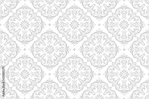 Wallpaper in the style of Baroque. A seamless vector background. White and grey floral ornament. Graphic pattern for fabric, wallpaper, packaging. Ornate Damask flower ornament.