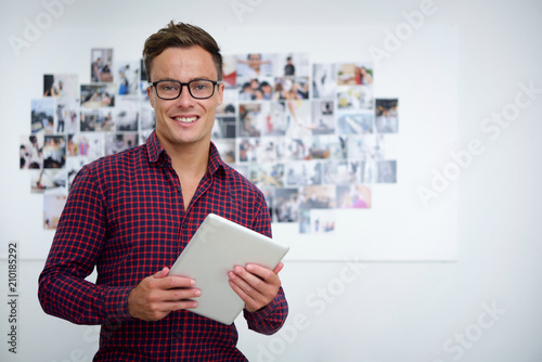 Happy man with digital tablet