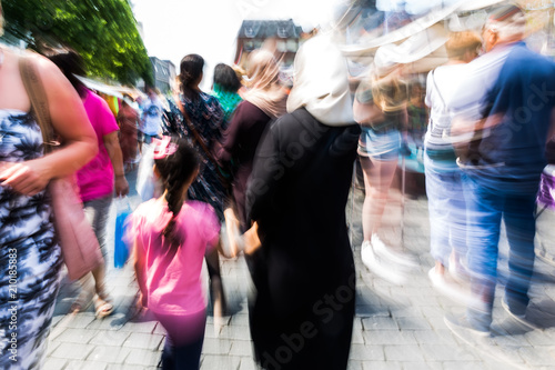 people walking in the city with zoom effect