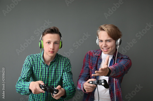 Teenagers with gamepads on ...